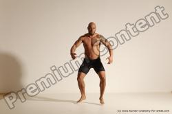 Underwear Gymnastic poses Man Black Muscular Bald Dancing Dynamic poses Academic